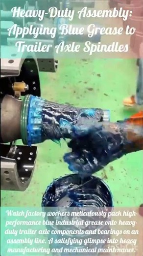 Heavy-Duty Assembly: Applying Blue Grease to Trailer Axle Spindles