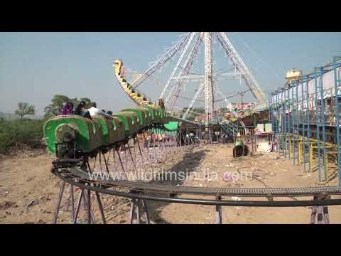 Thrilling Dragon ride rotation captured at pushkar fairground