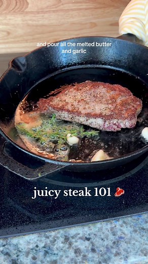 Juicy Steak 101 🥩 - start by getting a thick cut ny strip or ribeye - pat completely dry - season with a ton of garlic salt and course ground pepper (more than you think) - cast iron skillet on medium high (level 6) - 4 tbsp avocado oil (let it get PIPING HOT) - sear steak on one side until you see the cook line get to the middle - flip - add in a few cloves of garlic, garlic herb butter, and thyme - tilt pan and baste the steak in the butter and garlic - use a meat thermometer to make sure it’