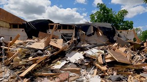 Pile of Total Destruction. Chaos following large scale demolition of a brick building. Panning views of the large pile of deconstructed materials.