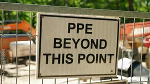 PPE beyond this point at industrial jobsite. PPE stands for Personal Protective Equipment and is advised to be worn, to prevent the spread of the Corona virus.