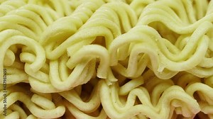 Noodle block ready for cooking slow pan 4K - Instant Chinese type noodles