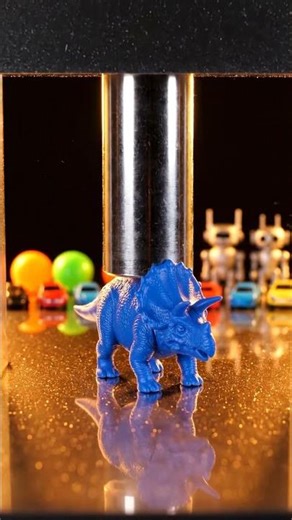 Hydraulic press crushes toy dinosaurs