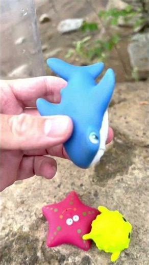 Dropping Toy Ocean Animals into a Tube for Toddlers