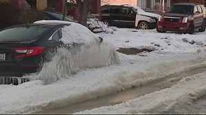 "I cannot move it"; Detroit water main break freezes resident's car to the street