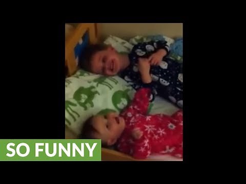 Little boy sends baby brother into laughing fit