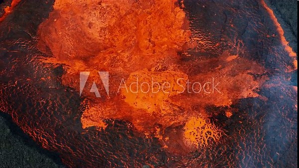 Awesome close up view of boiling red lava lake inside the active volcano crater, drone top down shot. Living volcano and eruption concepts.