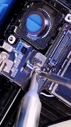 Removing an isolated screw on a laptop