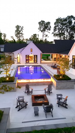 This backyard features multiple entertainment spaces along with a putting area, pool, fire features, hot tub spa, fire pit and a guest house with a wine cellar. Built By: @sunbyrnesproperties Would you want a backyard like this? | WayUp Media