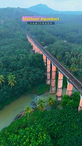 Mathoor Aqueduct Also known as Mathur Thottipalam, is a remarkable engineering marvel set amid the lush greenery of Kanyakumari district, Tamil Nadu. Stretching nearly one kilometer across the Parazhiyar River, this massive structure stands about 115 feet high, supported by a series of strong concrete pillars. Built in 1966, the aqueduct was designed to carry irrigation water from the Pattanamkal canal, helping nearby villages with agriculture. Surrounded by rolling hills, dense vegetation, and 