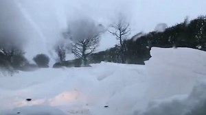 Car gets stuck in the road as heavy snow hits Norfolk