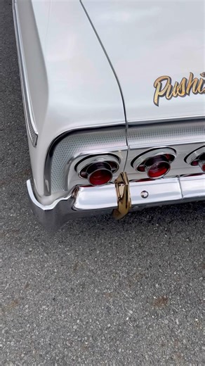 Custom lettering, gold leaf, and pinstriping on this 1964 Chevrolet Impala