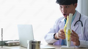 Professional male doctor imedical assistant wears white coat, headset video calling distant patient on laptop. Doctor talking to client using virtual chat computer app. Telemedicine.