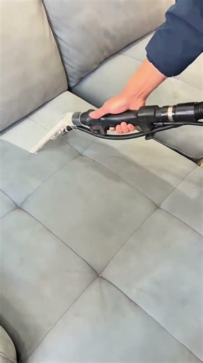 cleaning the sofa with a vacuum machine to remove dust and dirt to make it look clean again