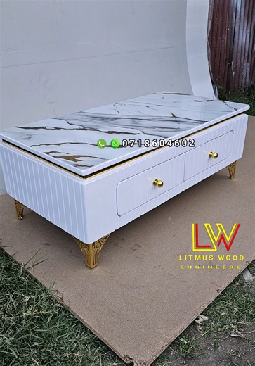 Coffee tables available. 254 718 604 602. standard size. uv marble top. two drawers with hydraulic runners. white with a match of gold. glossy finish. gold metallic legs. ksh13500 available in our Nairobi umoja and Nakuru KITI stores. we deliver countrywide. call or WhatsApp 254 718 604 602. #coffeetable #meza #nakuru #furniture #Nairobi