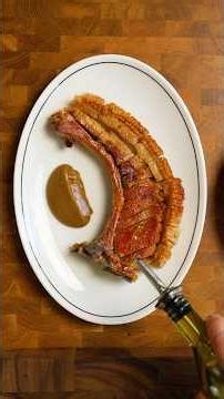 Crispy skin pork chop cooked on the new ‪@WeberBBQAusNZ‬ Genesis.