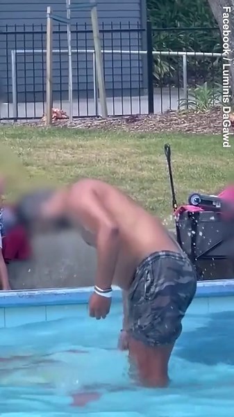 Man is seen washing himself in a children's swimming pool
