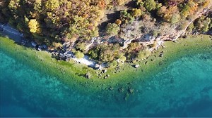 This turquoise lake is more than 2 million years old. But not everyone supports the fight to save it