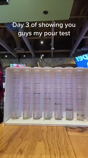 Colorful Liquid Pour Test in Cylindrical Test Tubes