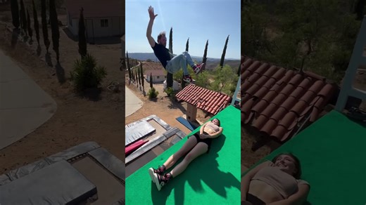 Amazing stunt leaping over model onto trampoline
