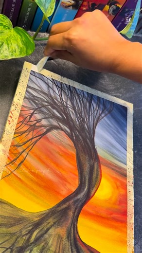 Thulasi Watercolourist 👩‍🎨 on Instagram: "🔥 “The Tree That Chose to Rise” 🔥 Some trees don’t grow straight — they grow strong. This painting is my tribute to that kind of resilience… the kind that bends, twists, and adapts, but never loses its fire. 🌪️🌳 Even against a blazing sky, even when the world pulls in every direction, this tree stands — rooted, alive, and full of movement. A reminder that your strength is not in how perfectly you stand, but in how beautifully you rise again and aga