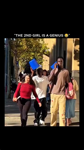 BeeBromy on Instagram: "The video follows a group of friends walking down a city street pulling a prank on one another. As someone’s pants get yanked down, the “victims” quickly grab blue plastic buckets to cover themselves and keep walking, turning the moment into an awkward but funny spectacle. The highlight is the second girl, who’s dubbed a “genius” for smoothly stepping straight into a bucket and covering up without breaking her stride. Credit & Source : The original source is unclear. The