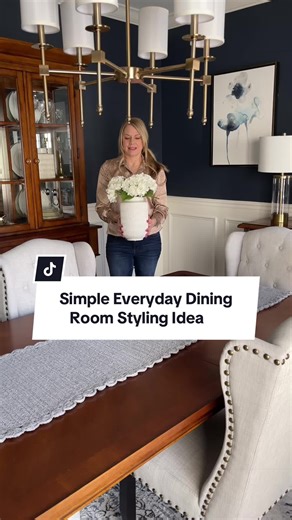 Looking for a simple everyday dining room tablescape? This one is perfect for spring and summer decor. This grouping works together because you have varying heights, shapes and texture. 🌿 Save and follow along for more home decorating ideas and home decor tips. #homedecorating #homedecorideas #homedecortips #diningroomdecor #centerpieces