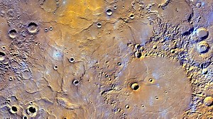 NASA released this map of Mercury made from 100,000 pictures. Brown, yellow & red = higher elevations. Blue & purple = lower elevations. | Jessica Schambach