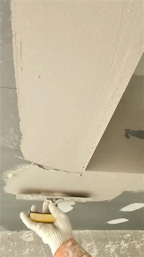 Applying Plaster to a Curved Ceiling Structure for a Smooth Finish