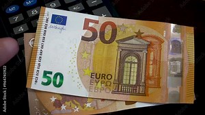 Detailed close-up of the 50 euro banknote from both sides. Aesthetics of the European banknotes.