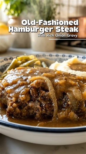 🥩 Old-Fashioned Hamburger Steak With Rich Onion Gravy (Southern Comfort Food Classic, Better Than Takeout) juicy hamburger steak smothered in rich onion gravy — this is the kind of old-school diner comfort that never goes out of style 🤎 thick, savory, and made for mashed potatoes. ⏱️ recipe details prep time: 15 minutes cook time: 30 minutes servings: 4 🧾 ingredients hamburger steaks 1½ lbs ground beef ½ cup breadcrumbs 1 egg 2 tablespoons milk 1 teaspoon salt ½ teaspoon black pepper ½ teaspo
