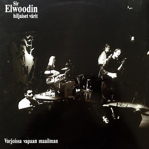 Sir Elwoodin Hiljaiset Värit - Varjoissa Vapaan Maailman