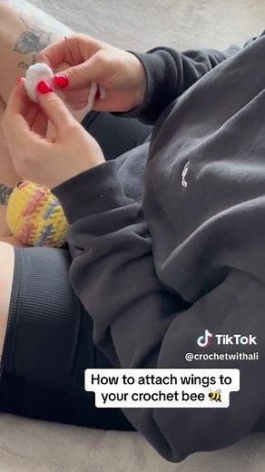 As requested a quick tutorial on how to attach wings to your crochet bee! 🐝 (sped up version) Sorry I’m out of frame a bit. My kitten pushed my tripod over 😂 #crochetmarket #crochettok #marketprep #crochettoys #sew #crochetbee #fyp #foryou #foryoupage #crochet