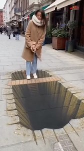 She almost had a heart attack! 😱 Watch this incredible 3D street art trick her into thinking the sidewalk was disappearing. This optical illusion is absolutely mind-bending! ✨🎨 #3DArt #OpticalIllusion #StreetArt #FunnyPranks #MindBlowing #StreetMagic | Urban Pranks America