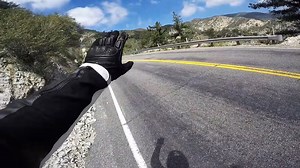 Watch This Motorcyclist Fall Off a Cliff and Survive