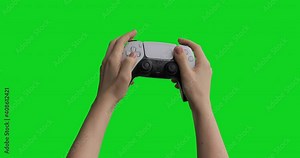 Teenager using gamepad wireless controller pressing keys and sticks and playing competitive action shooter console games. Isolated chroma key background.