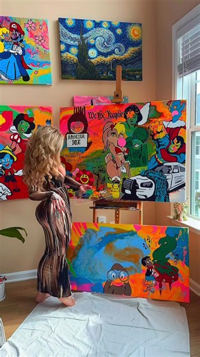 I curate three to four pieces at a time because my creativity refuses to be boxed into a single lane. My process is layered, restless, and alive I need multiple worlds to move between so none of them ever lose their spark. That isn’t chaos; that’s how I protect the depth of my work. Mediocrity has no place here. One of the pieces I’m currently layering into is my We the People work. I’ve decided to add another element I placed another statue of liberty, but this time beside Labubu under the word