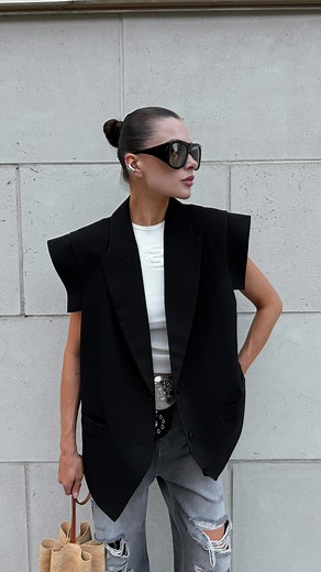 BAZHANE on Instagram: "BAZHANE OUTFIT FORMULA black vivid vest + milk top + ripped jeans A study in contrast — structured tailoring layered over soft minimalism. For the days when you want to look effortless, but entirely intentional."