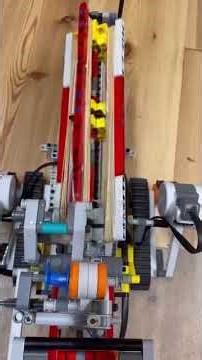 Self made lego tank with rotating canon, remote control and docking for a phone running Teams.