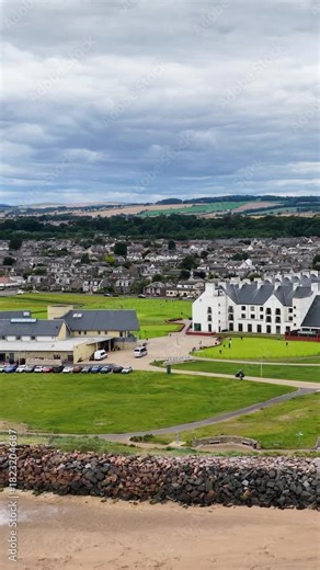 Aerial Approach Over Carnoustie Golf Course Toward Scottish Town