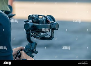 Gimbal stabilizer with mirrorless digital camera anti shake for video production cinematography Stock Photo - Alamy