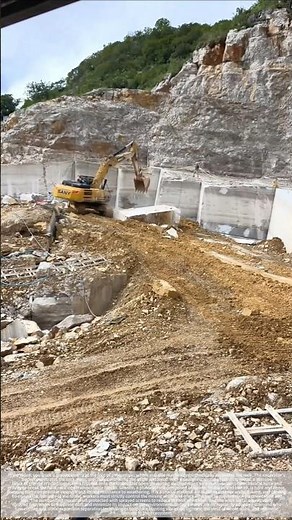 A shovel lifts a ton of rock: The granite mining process