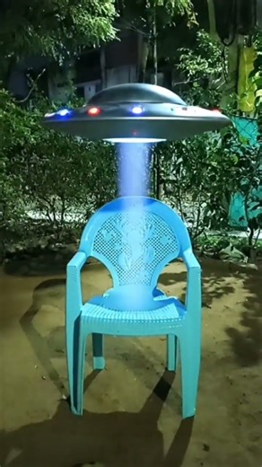 The Alien sat on the chair...