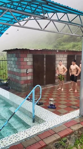 Adults Jumping into Pool: Fun Water Splashing Moments