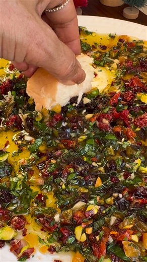 Chhaya Joshi Daily food / cocktails on Instagram: "Loaded Bread Dipping Oil Appetizer Instagram @cookwithchay Easy and delicious! Perfect for entertaining! Add any items you have on hand ! I used the following: 1. 1 cup olive oil - more as needed 2. 3-4 tablespoons chopped dried apricots and cranberries 3. 3-4 tablespoon chopped nuts - I used pistachios 4. 1/4 cup chopped fresh herbs- rosemary, sage, basil 5. 2 tablespoons chopped fresh Italian parsley 6. 2 tablespoons minced garlic 7. 1 tablesp