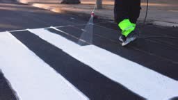 Process of making new road surface markings with a line striping...