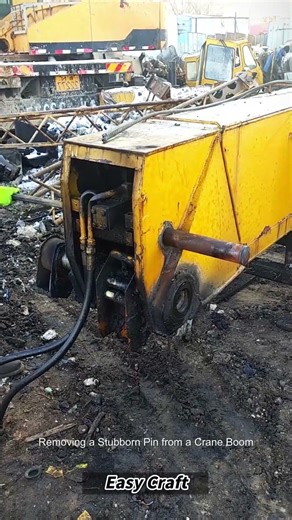 Removing a Stubborn Pin from a Crane Boom