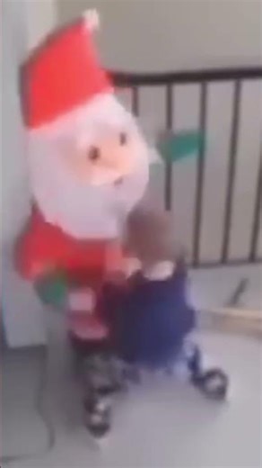 Kid punching balloon Santa
