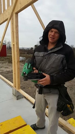 Hitachi cordless framing nailer in action.