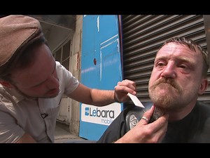 Barber cuts hair of homeless